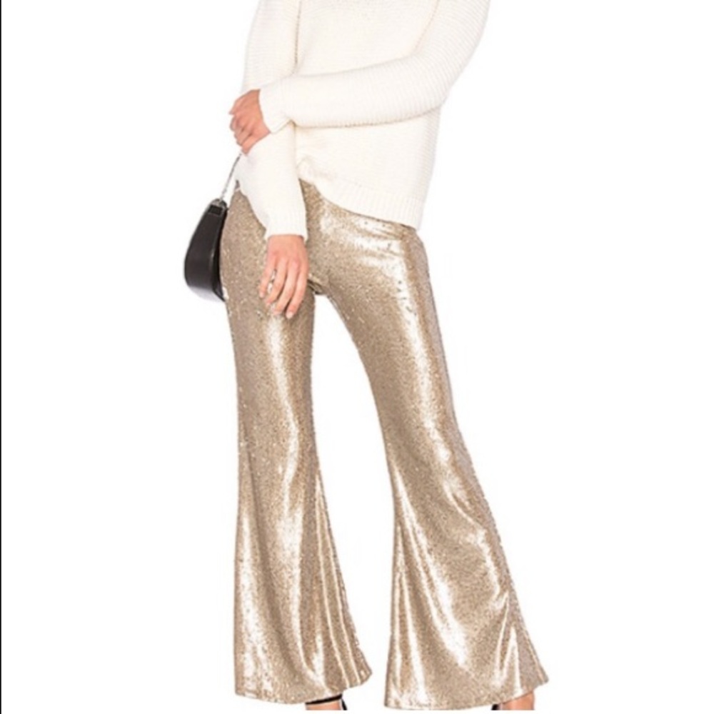New without tags, size 2, free people champagne sequin flare pant. Low rise.